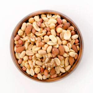 Mixed nuts in wooden bowl on white background.