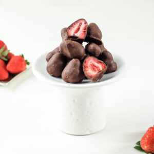Dried strawberry coating with milk chocolate. on white background